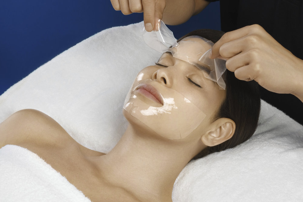 Omni Bioceuticals medical grade luxury skincare for men and woman using mask at spa