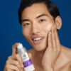Omni Bioceuticals medical grade luxury skincare facial serum for men and woman man using face serum