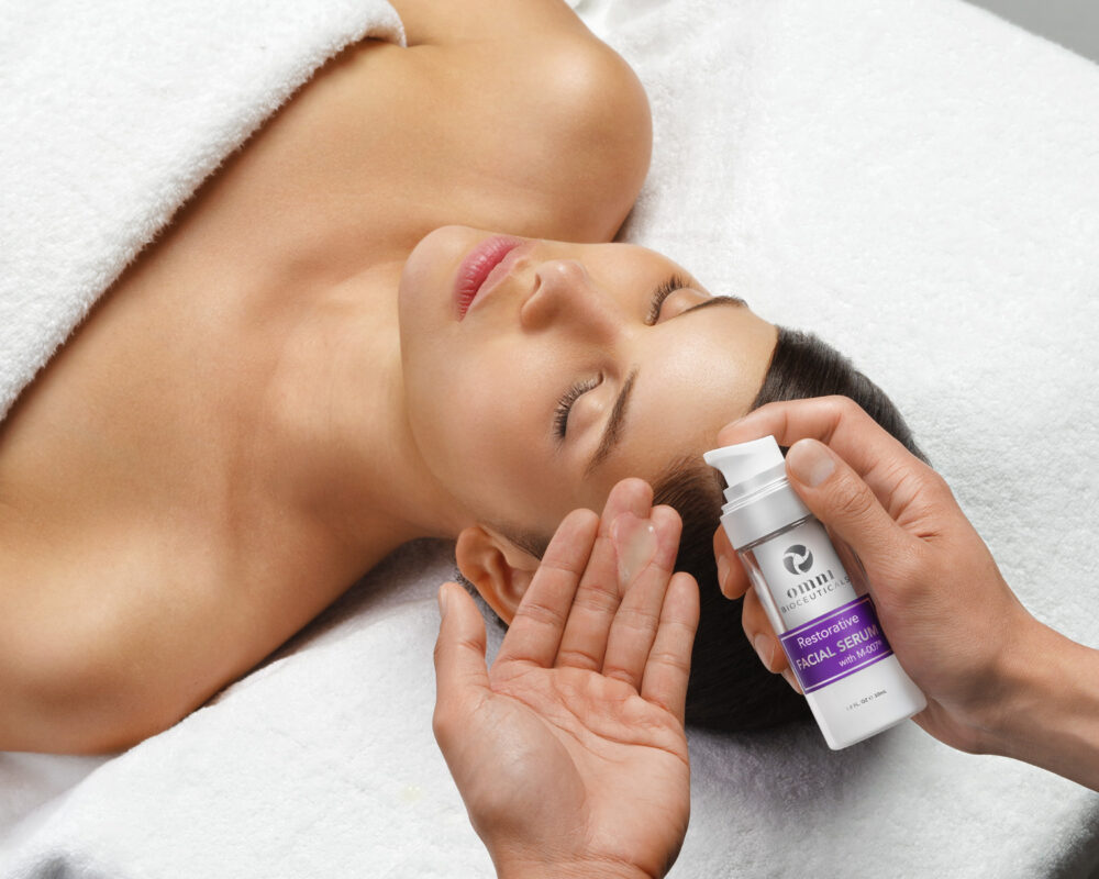 Omni Bioceuticals medical grade luxury skincare facial serum serum being used in spa
